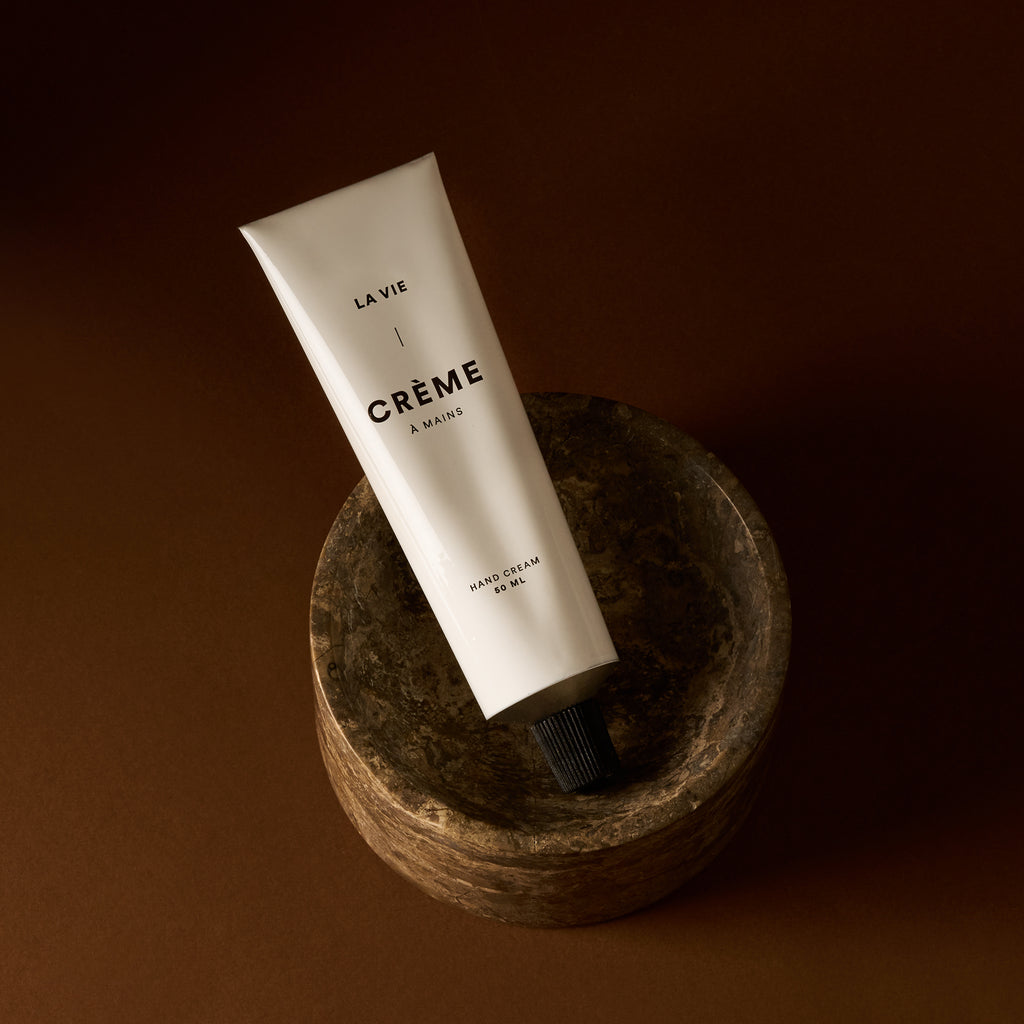 LA VIE Hand Cream Tube — Chic and minimal in a natural setting.